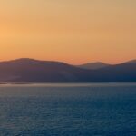 Mountains and sea sunset glow