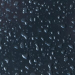 Waterdrops on dark backdrop