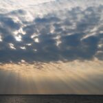 African sunbeams piercing cloudy sky