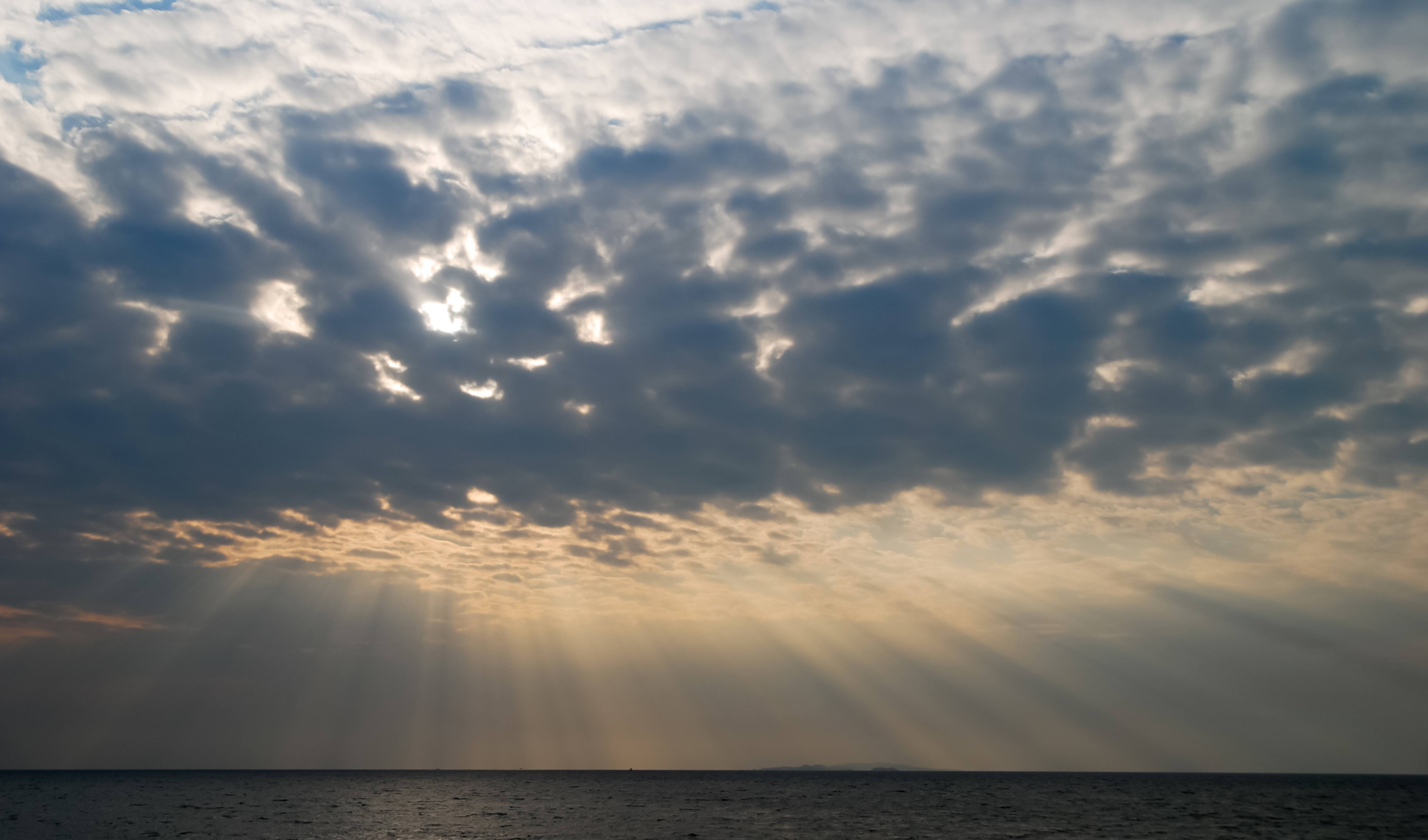 African sunbeams piercing cloudy sky
