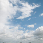 Big white clouds and a bit of blue sky
