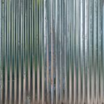 Close-Up Of A Shiny Corregated Steel Wall
