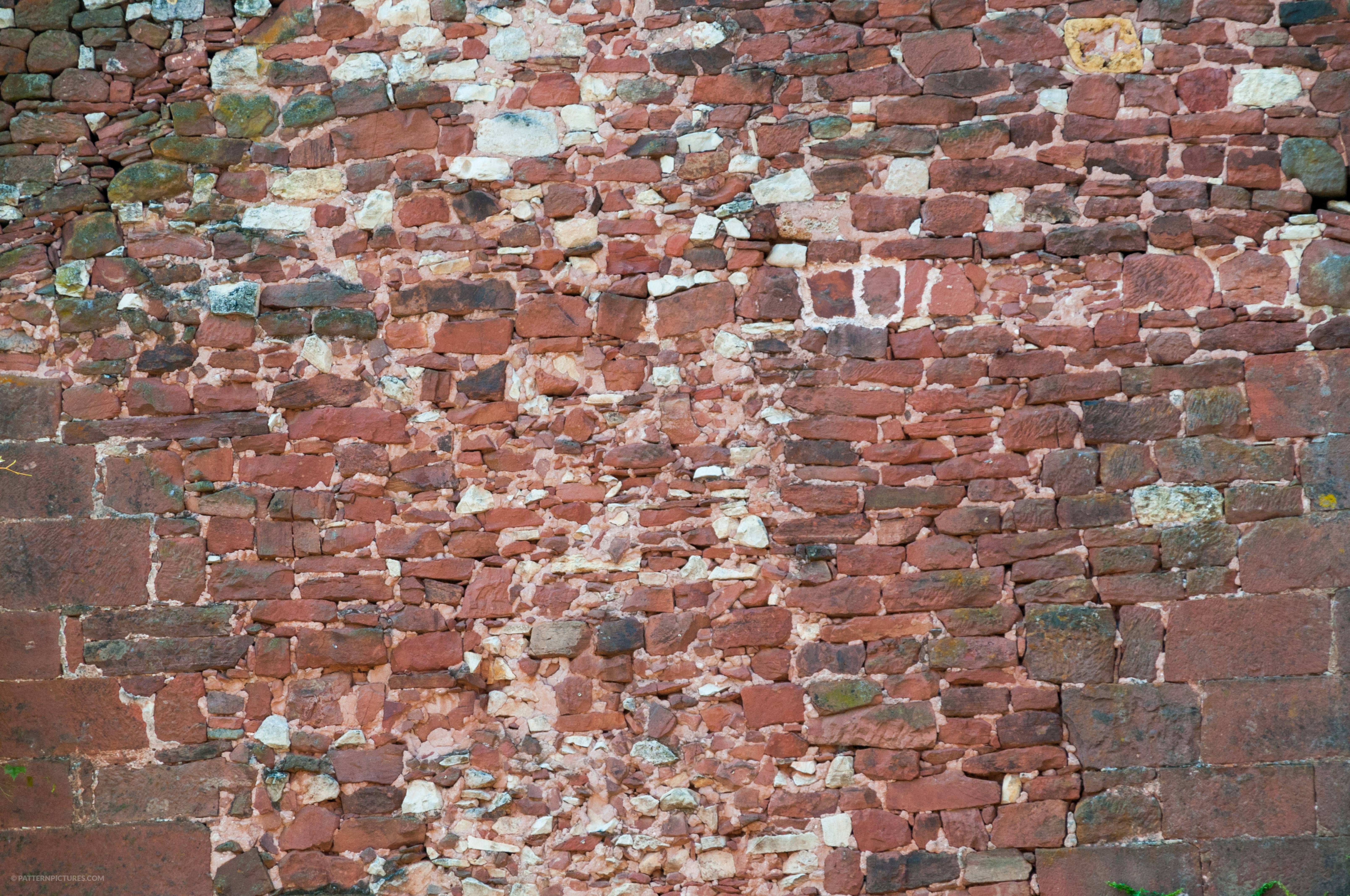 Collected bricks and stones wall background