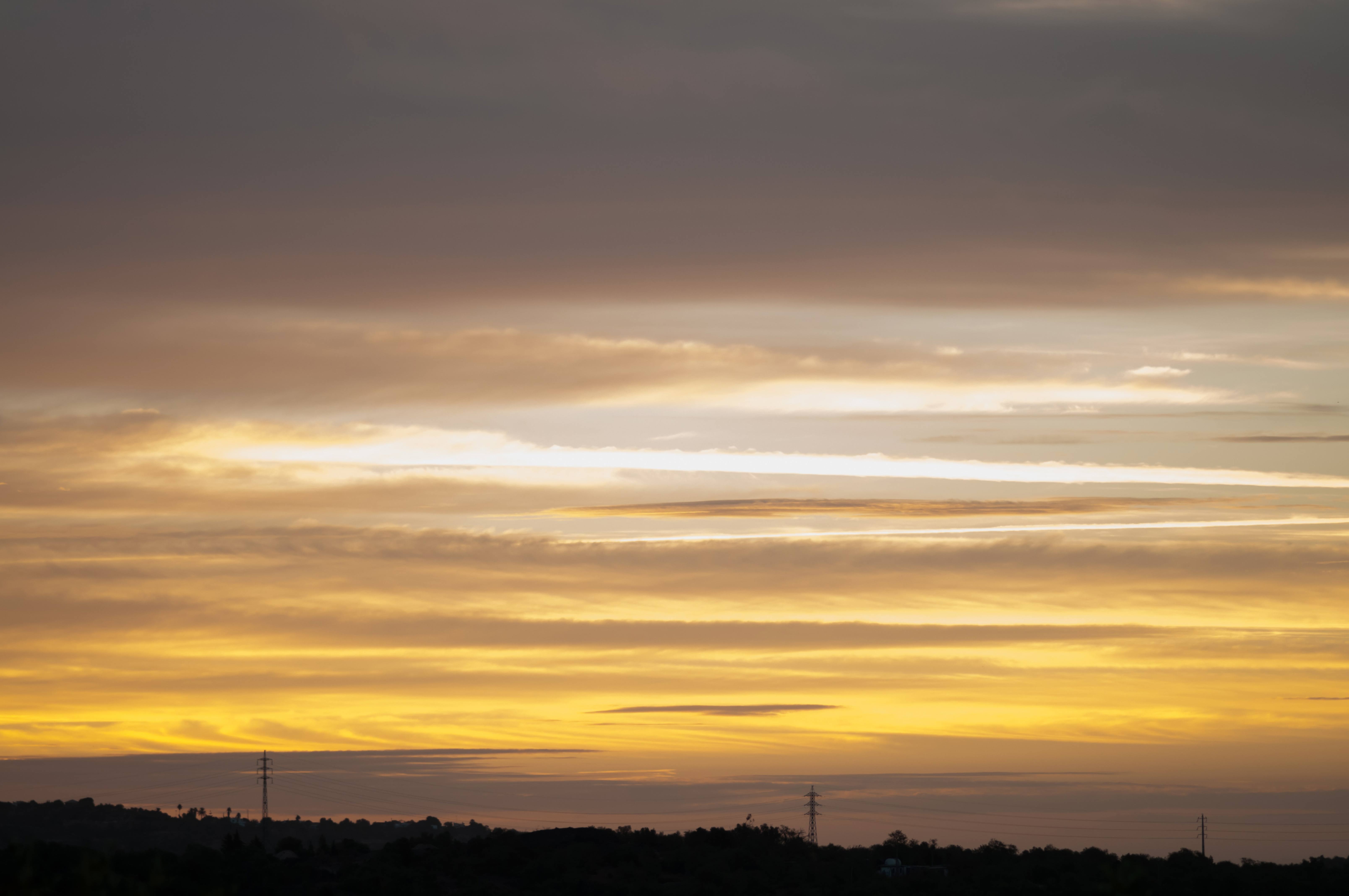 Early Morning Yellow Sky Clouds and Sunlight