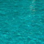 Green blue rippling pool water texture