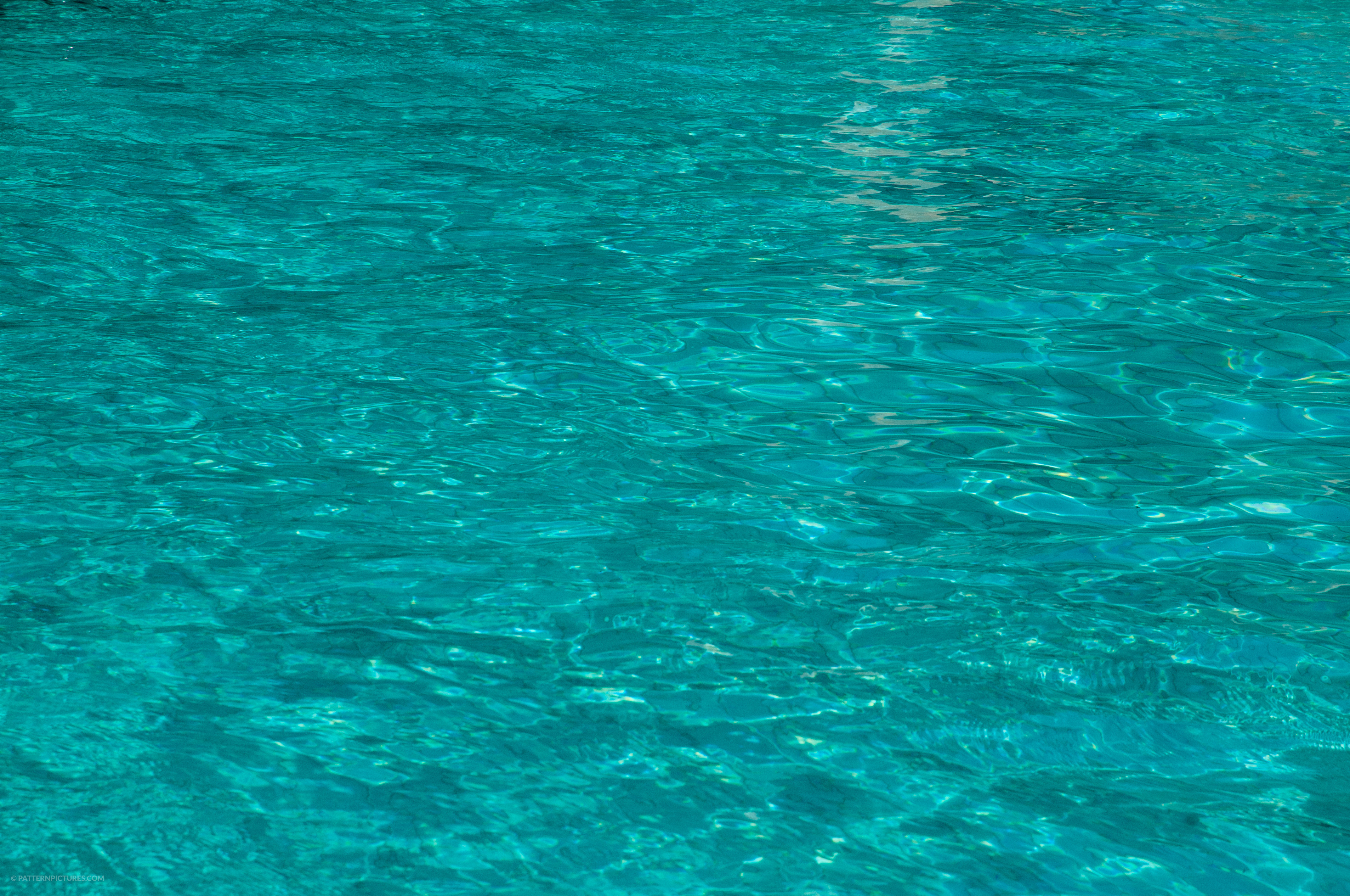 aGreen blue rippling pool water textureGreen blue rippling pool water texture