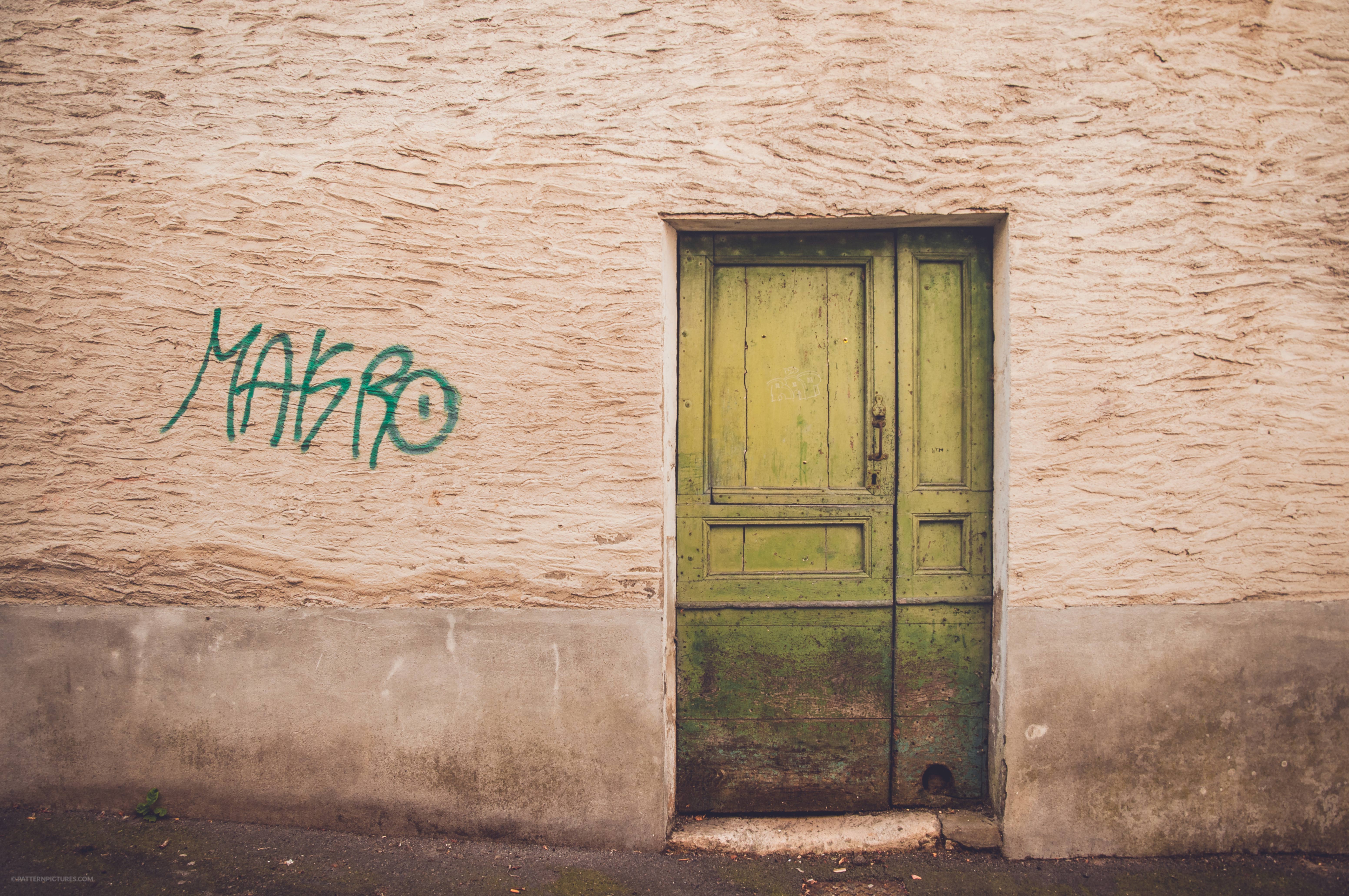Green door and grafiti urban scene