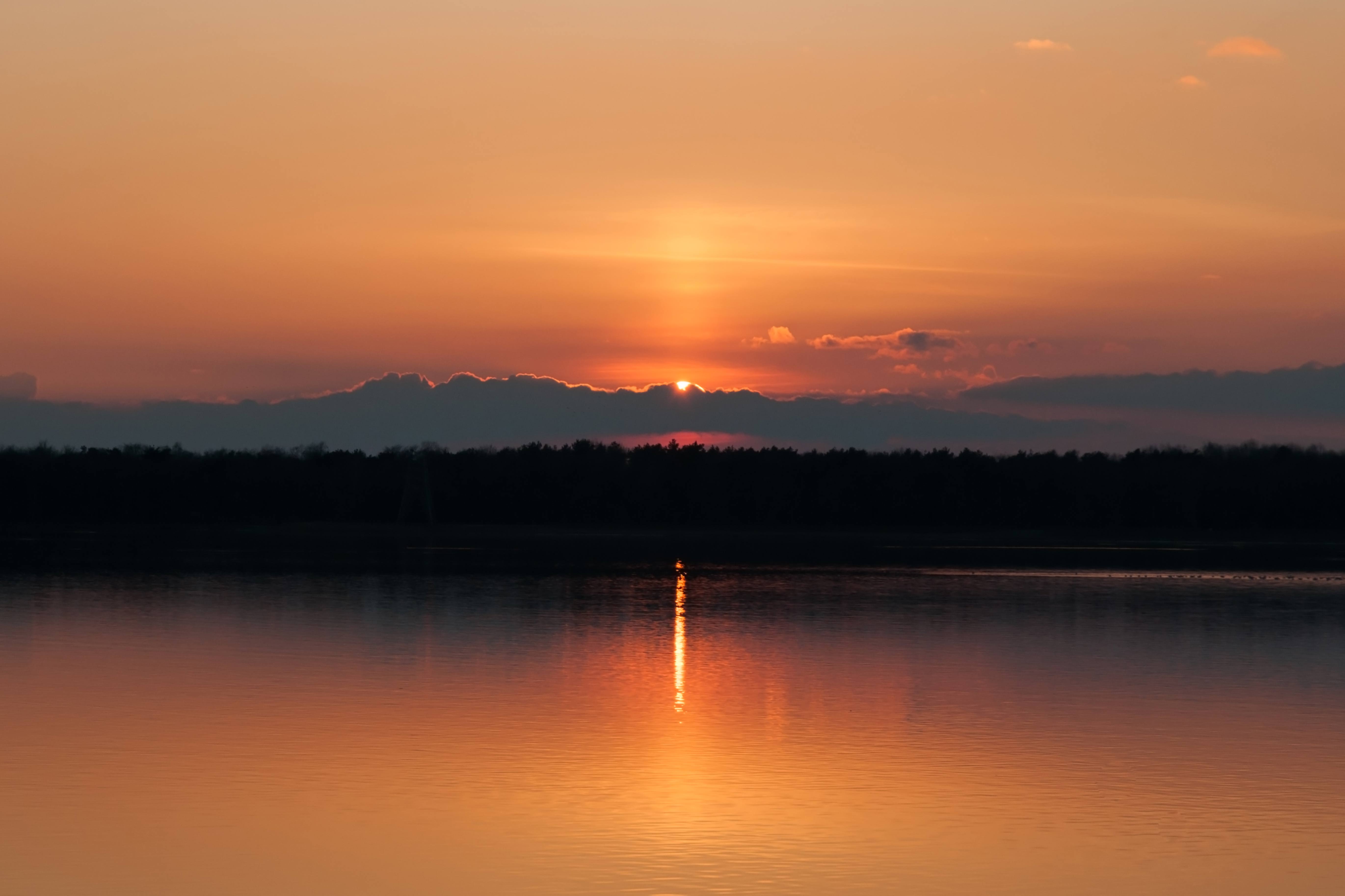 Lake sunset light beam
