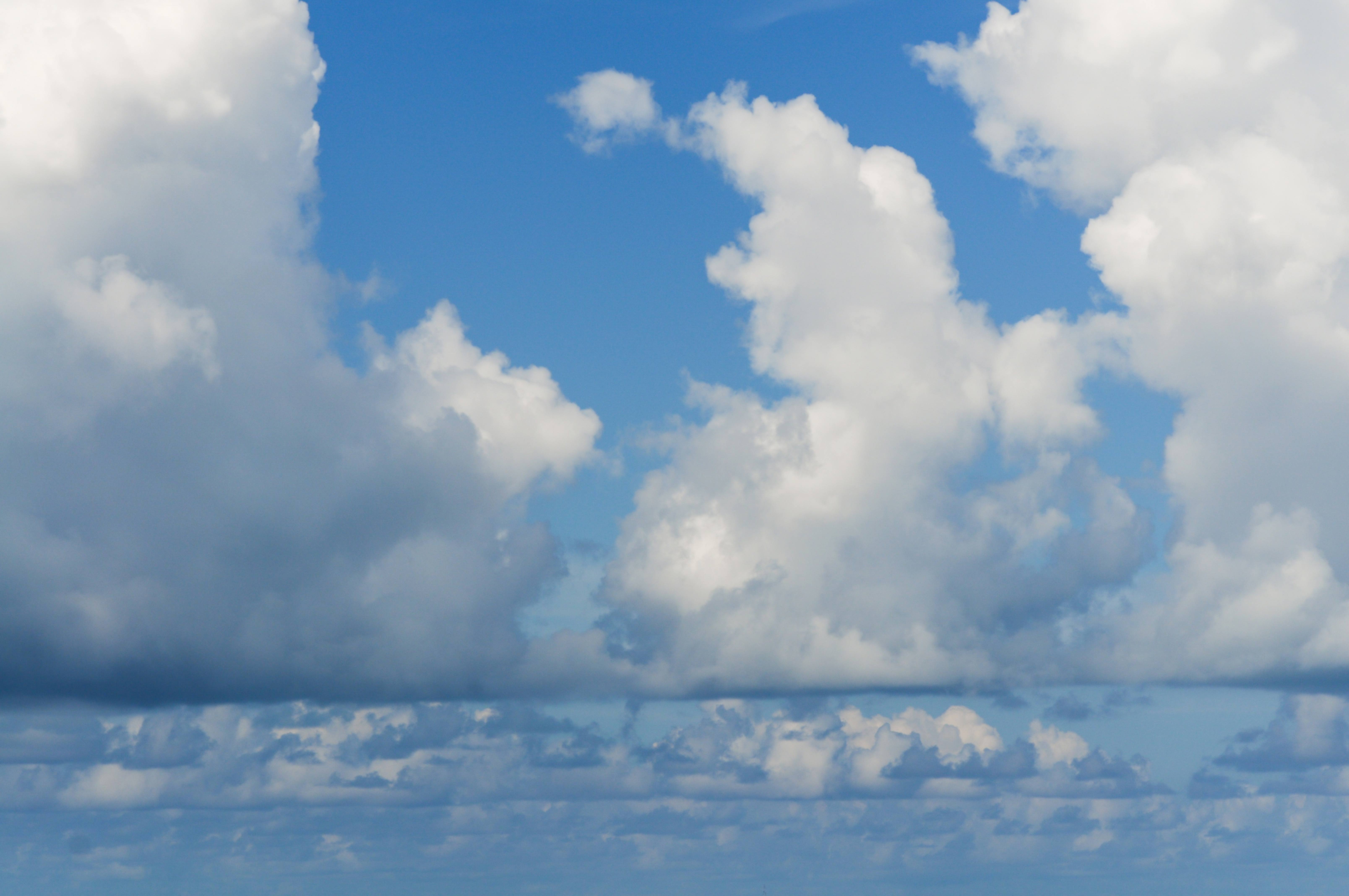 Low White Clouds on a Blue Sky Backdrop