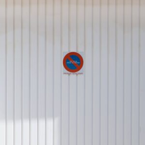 Proibido Estacionar White Metal Garage Door