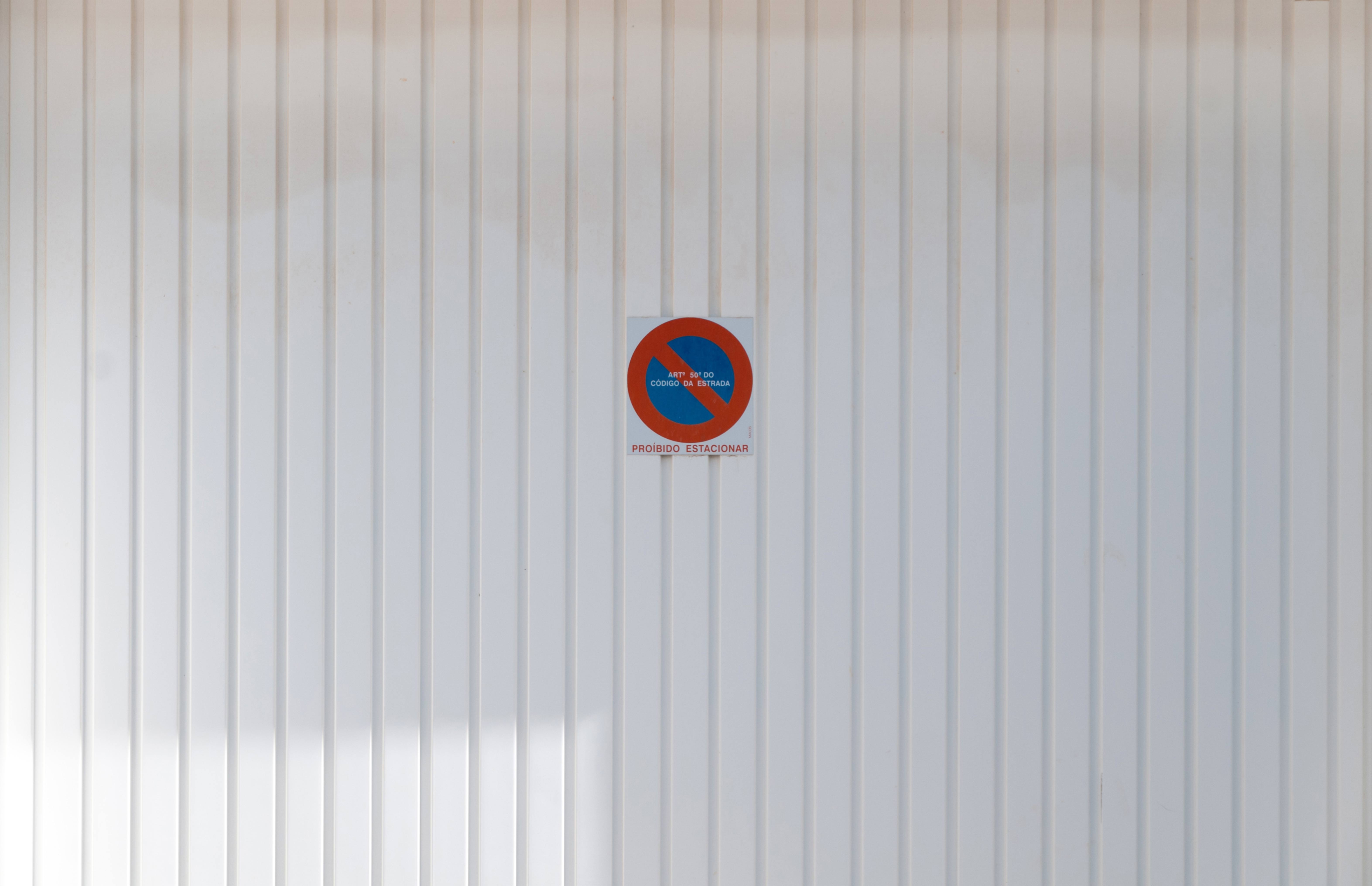 Proibido Estacionar White Metal Garage Door