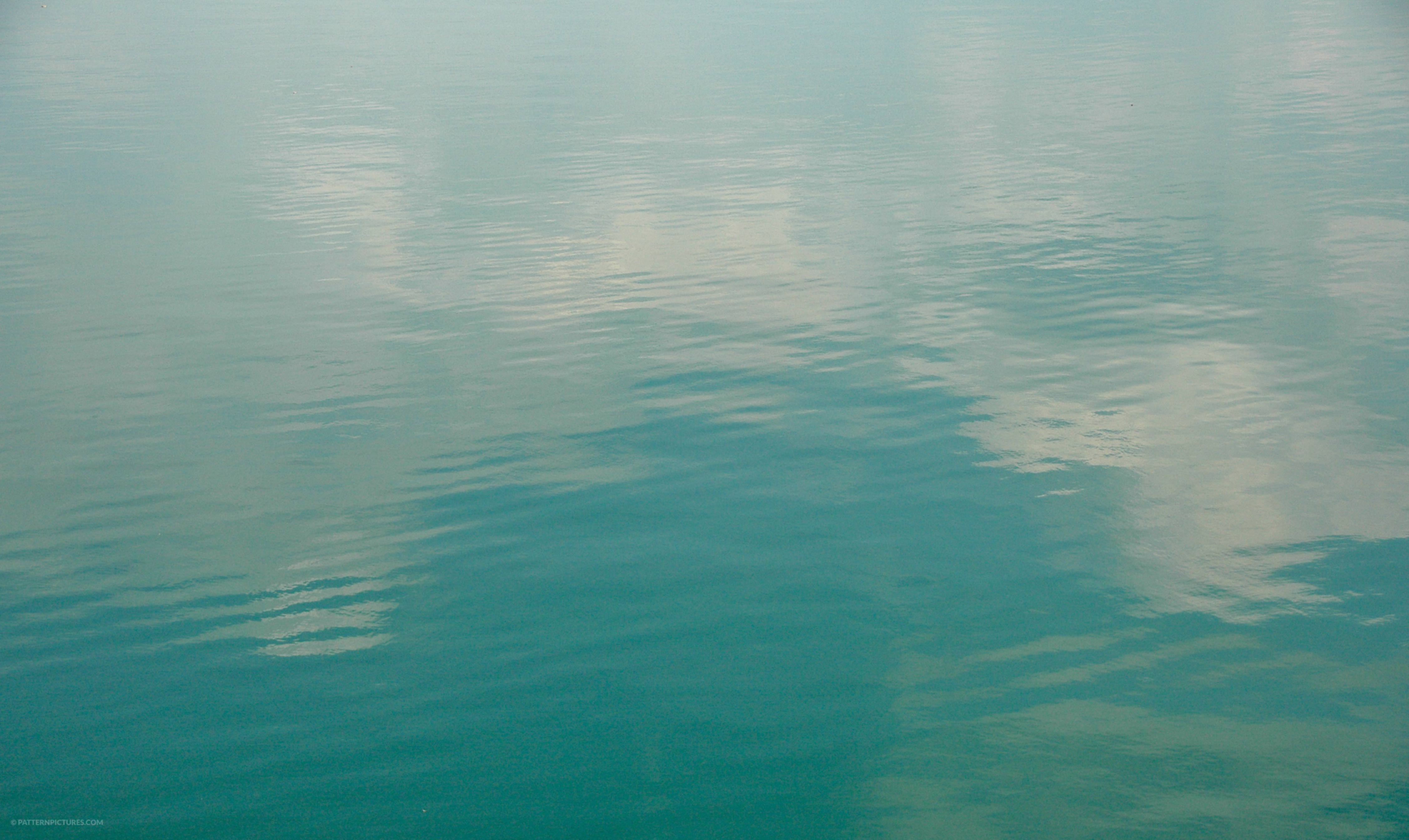 Sea water texture clouds reflection