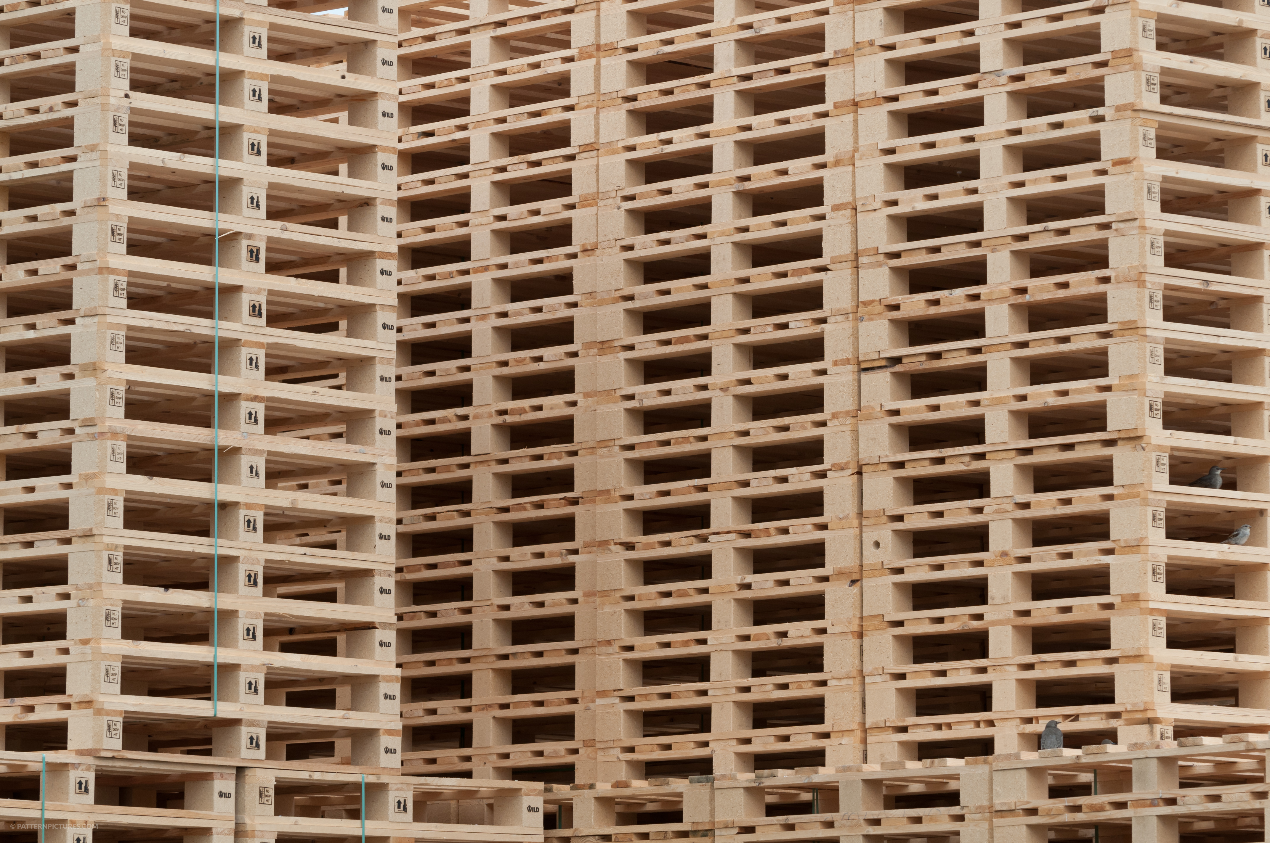 Stacked wooden pallets at a pallet storage