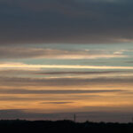 Striped thin clouds sunset sky