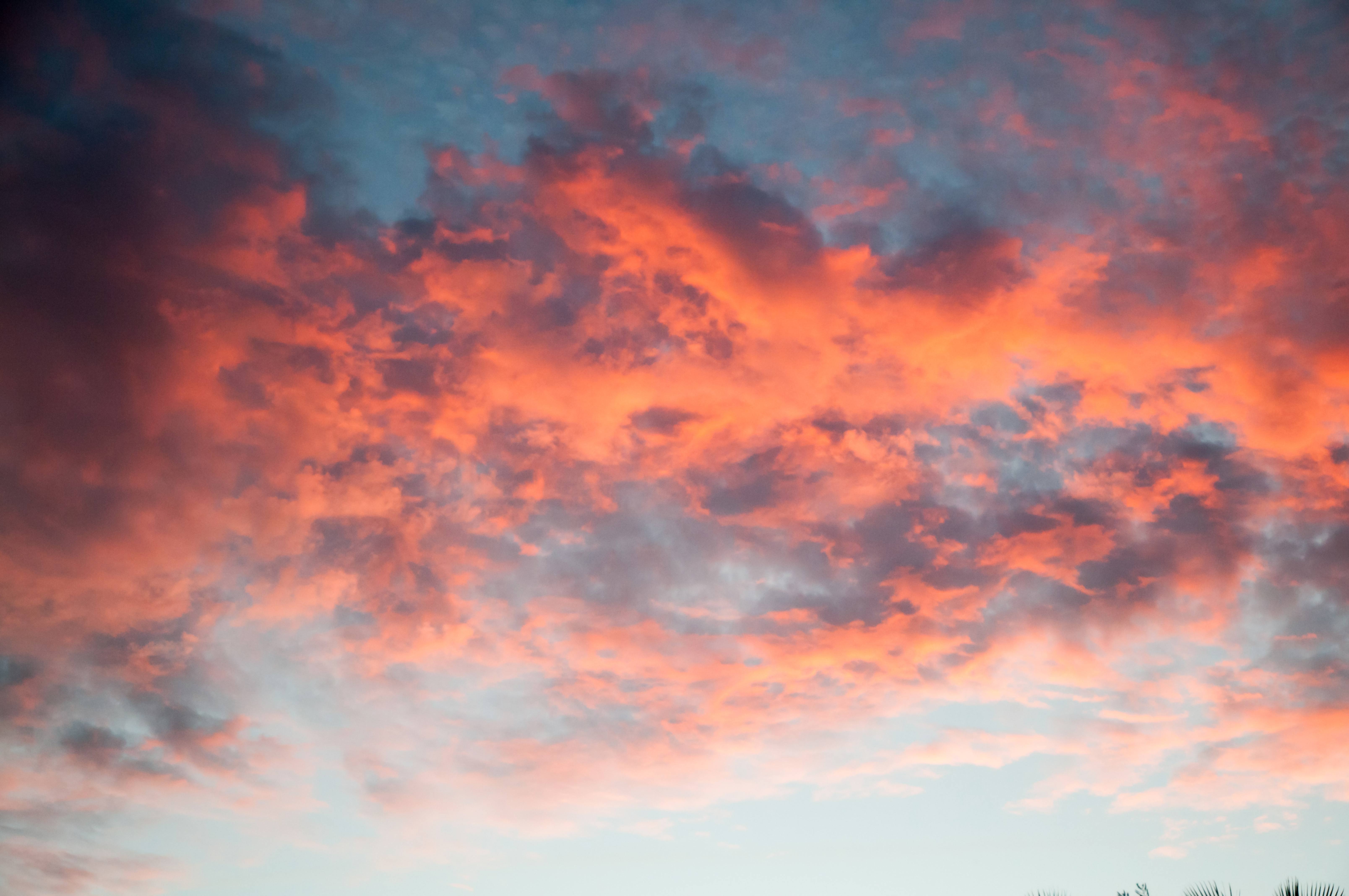 Sunset Reflected on Orange Bright Lit clouds