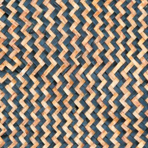 Tan woven leaf mat with black zig zag pattern
