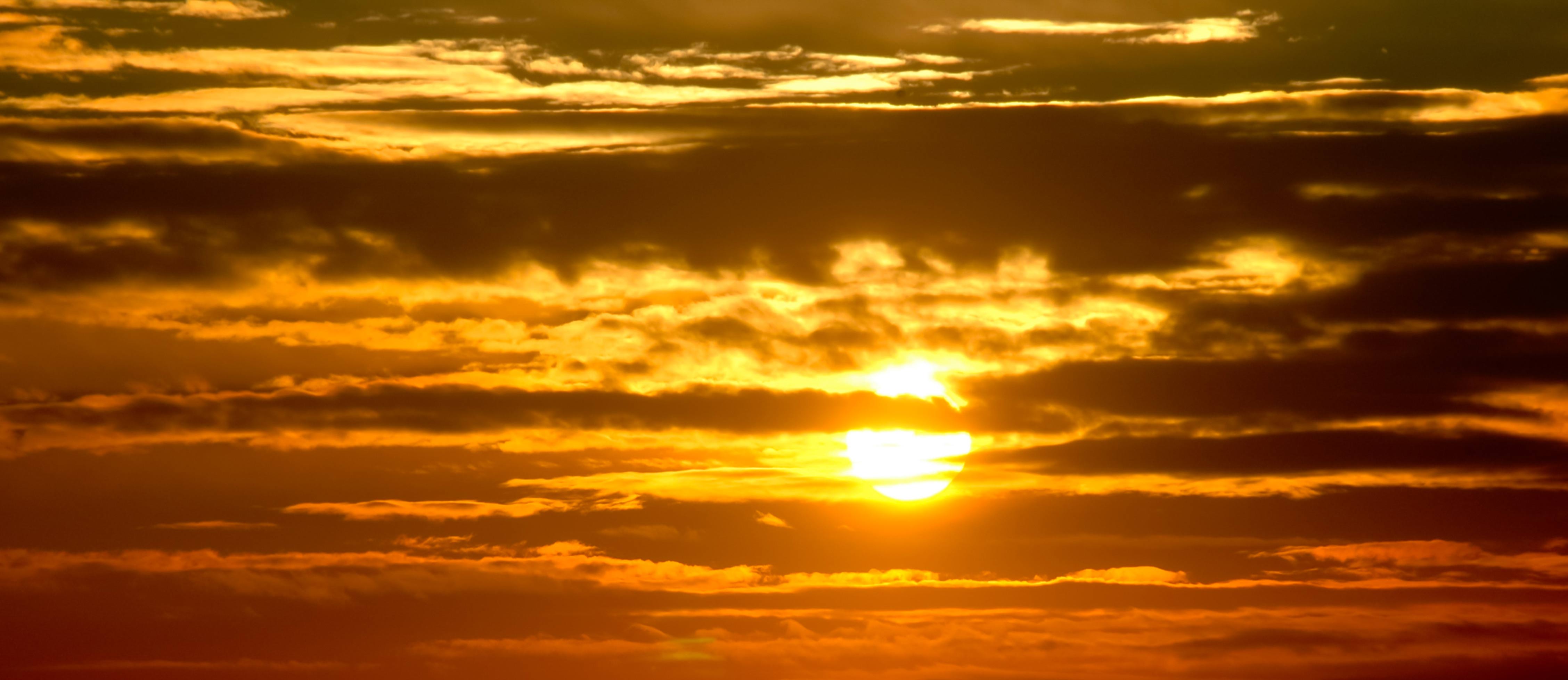 Warm Orange Red Sunset Sky and Clouds