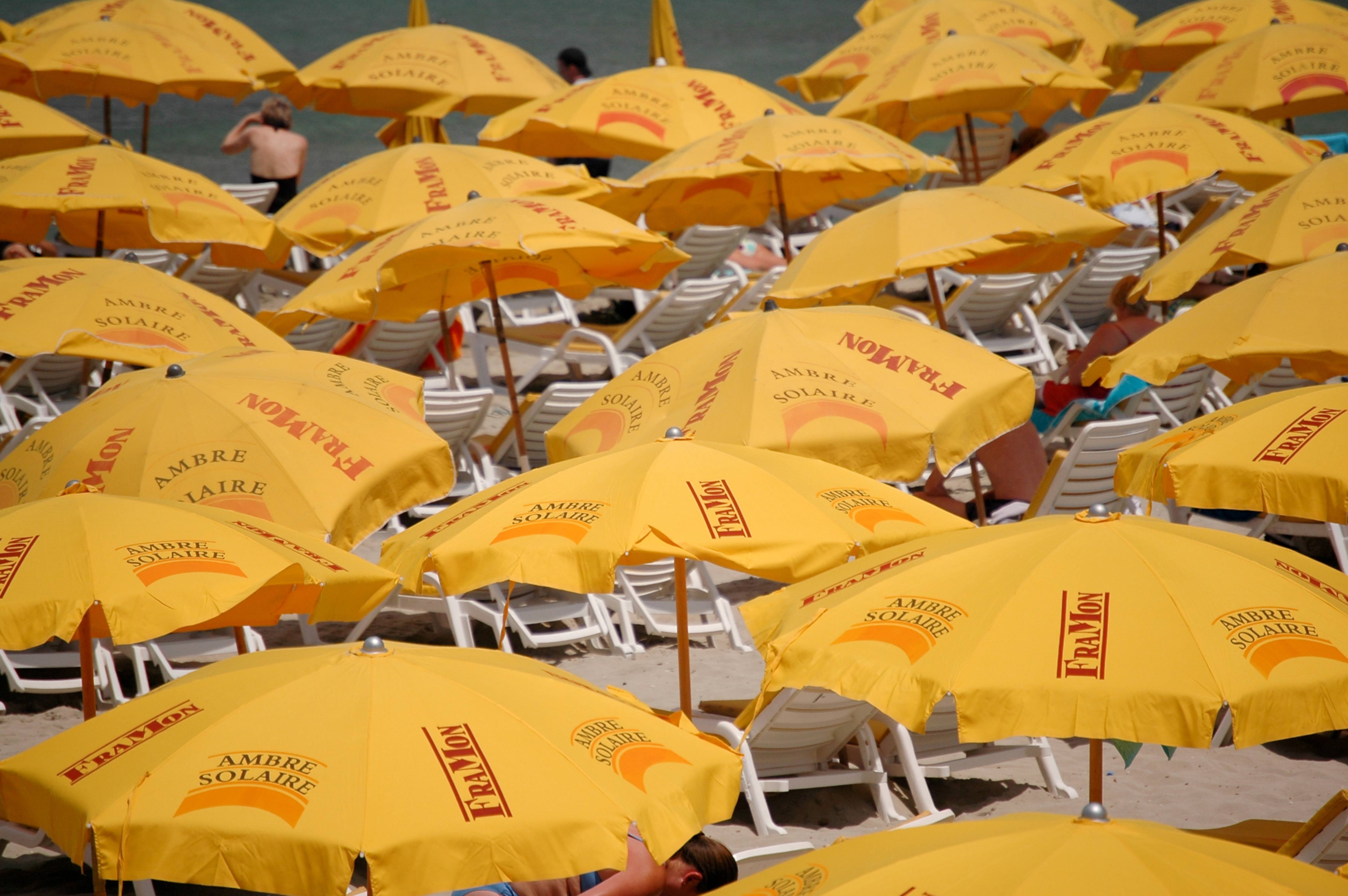 Yellow umbrellas on a sunny beach
