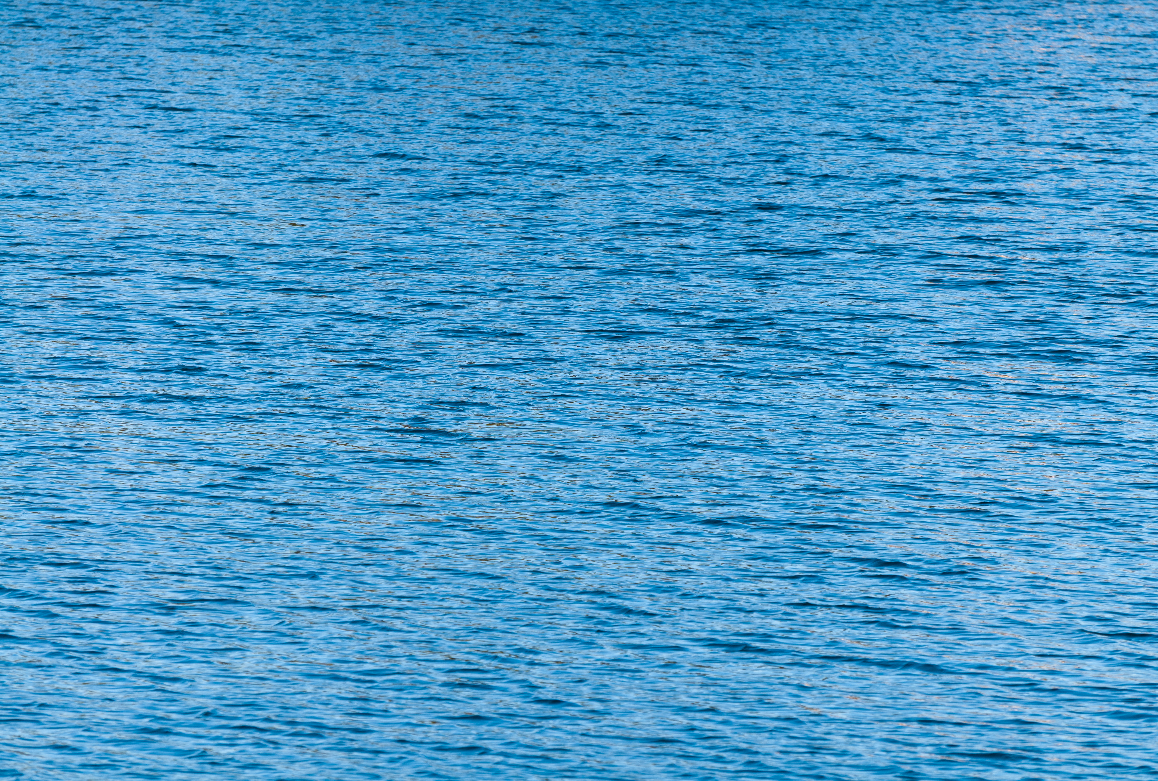 Calm water texture blue background