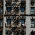 Fire ladder at old houses downtown in New-York