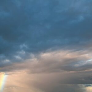 Cloudy sky and rainbow
