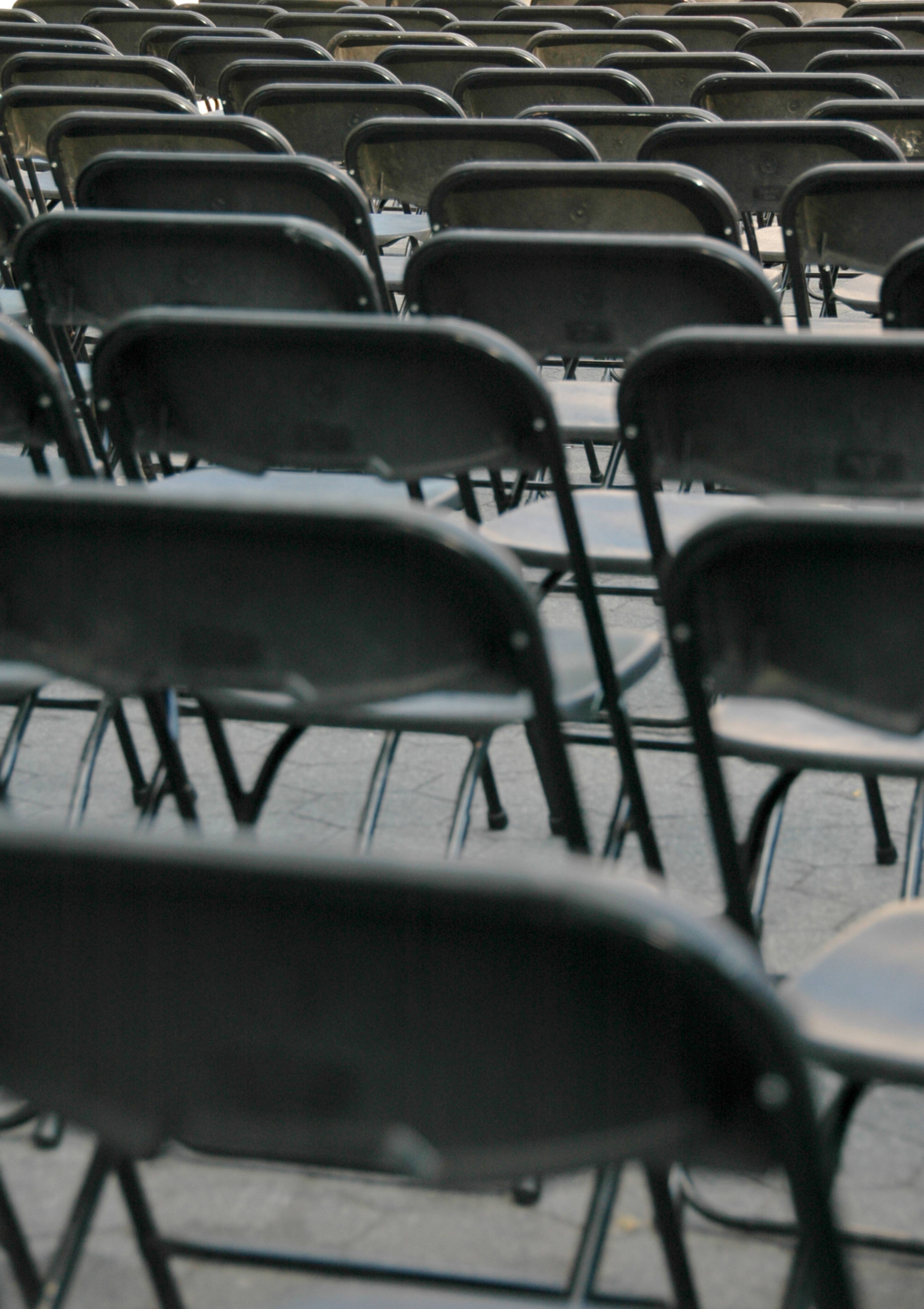 Pattern of Empty Black Folding Chairs