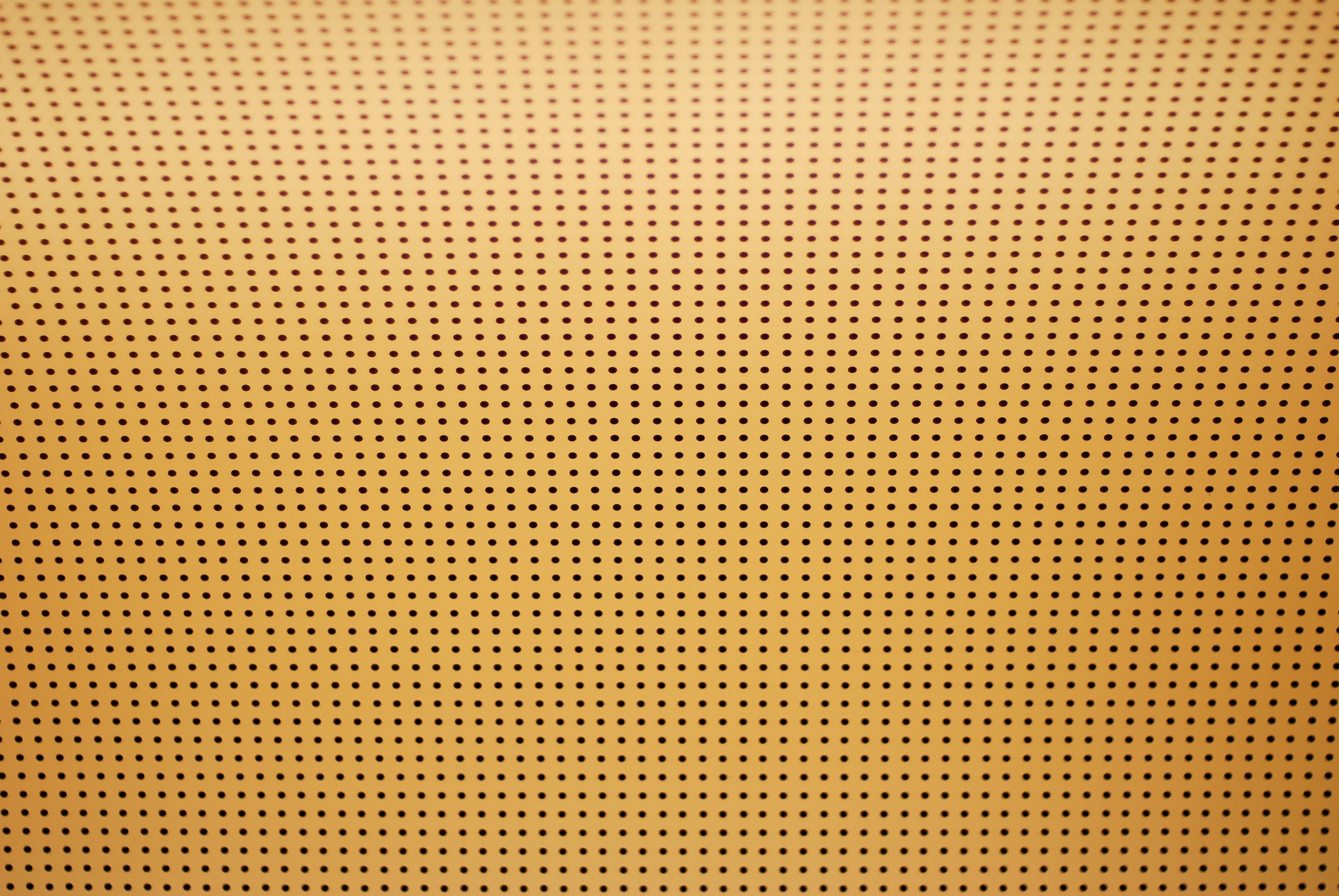 Perforated ceiling yellow background