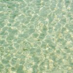 Reflective glare sunny tropical beach water