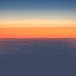Sun and Dark Clouds Shot from Airplane Window