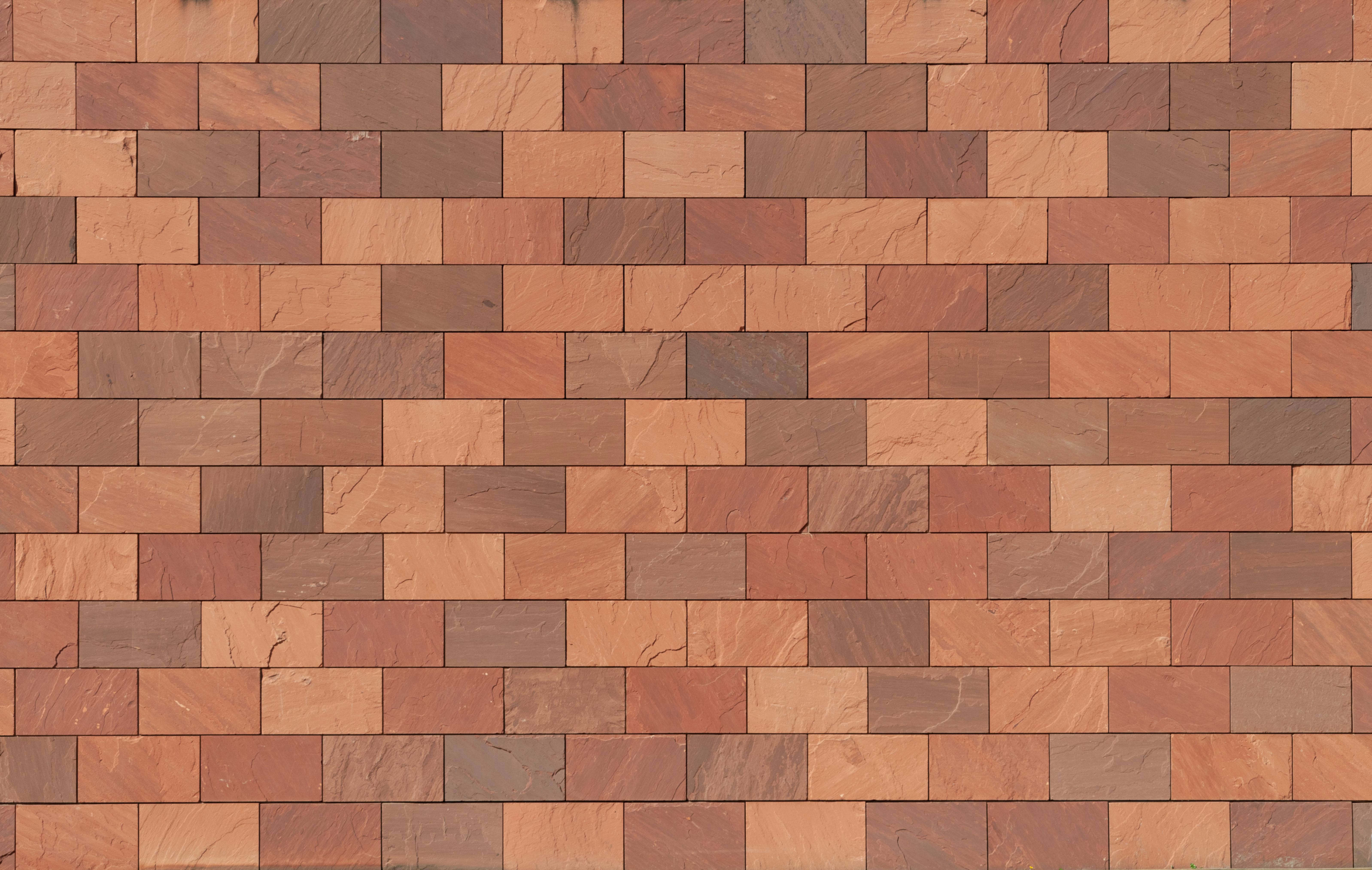 Heavy red stone facade bricks wall background