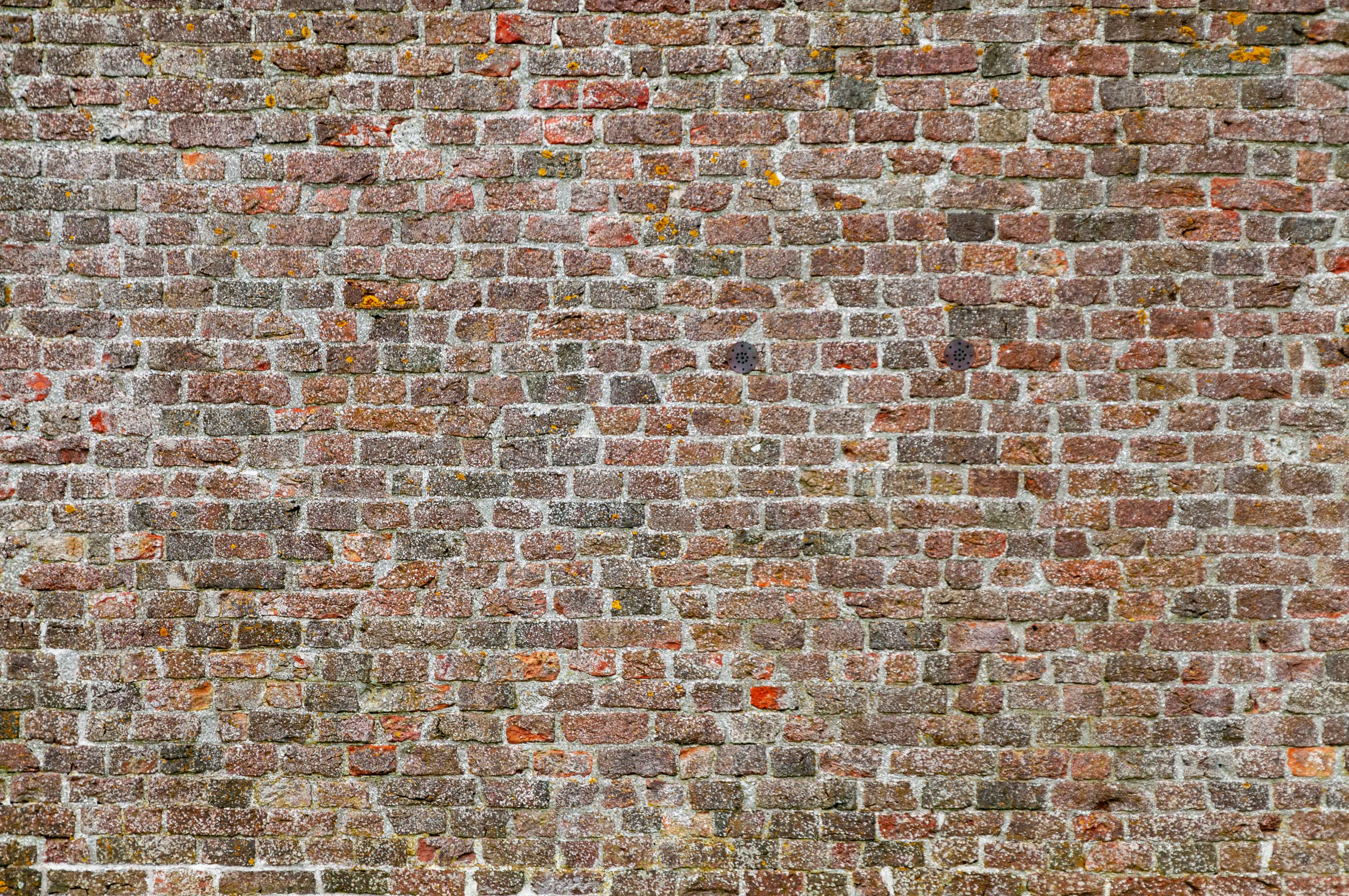 Old small bricks wall background