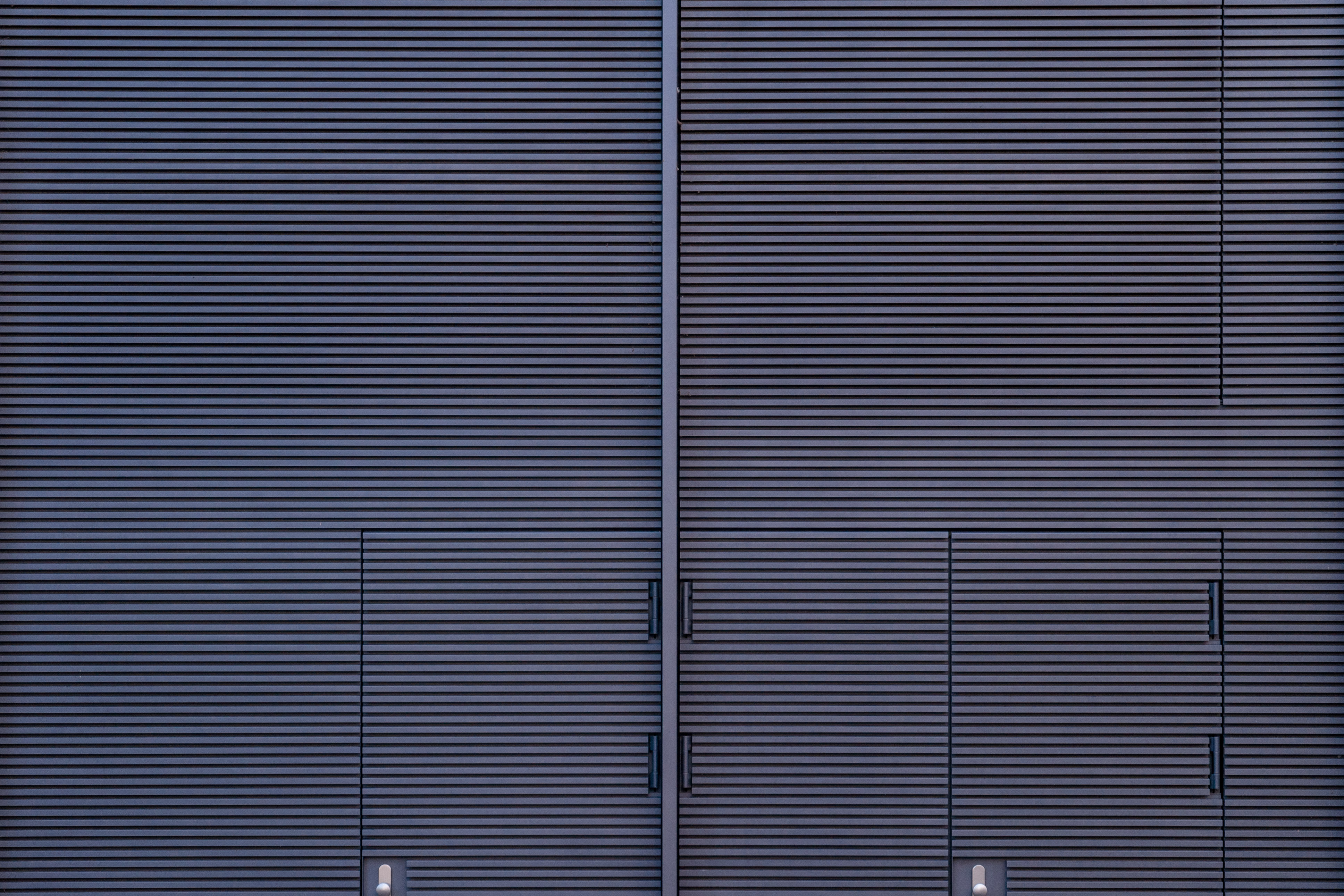 Architecture dark grey striped doors