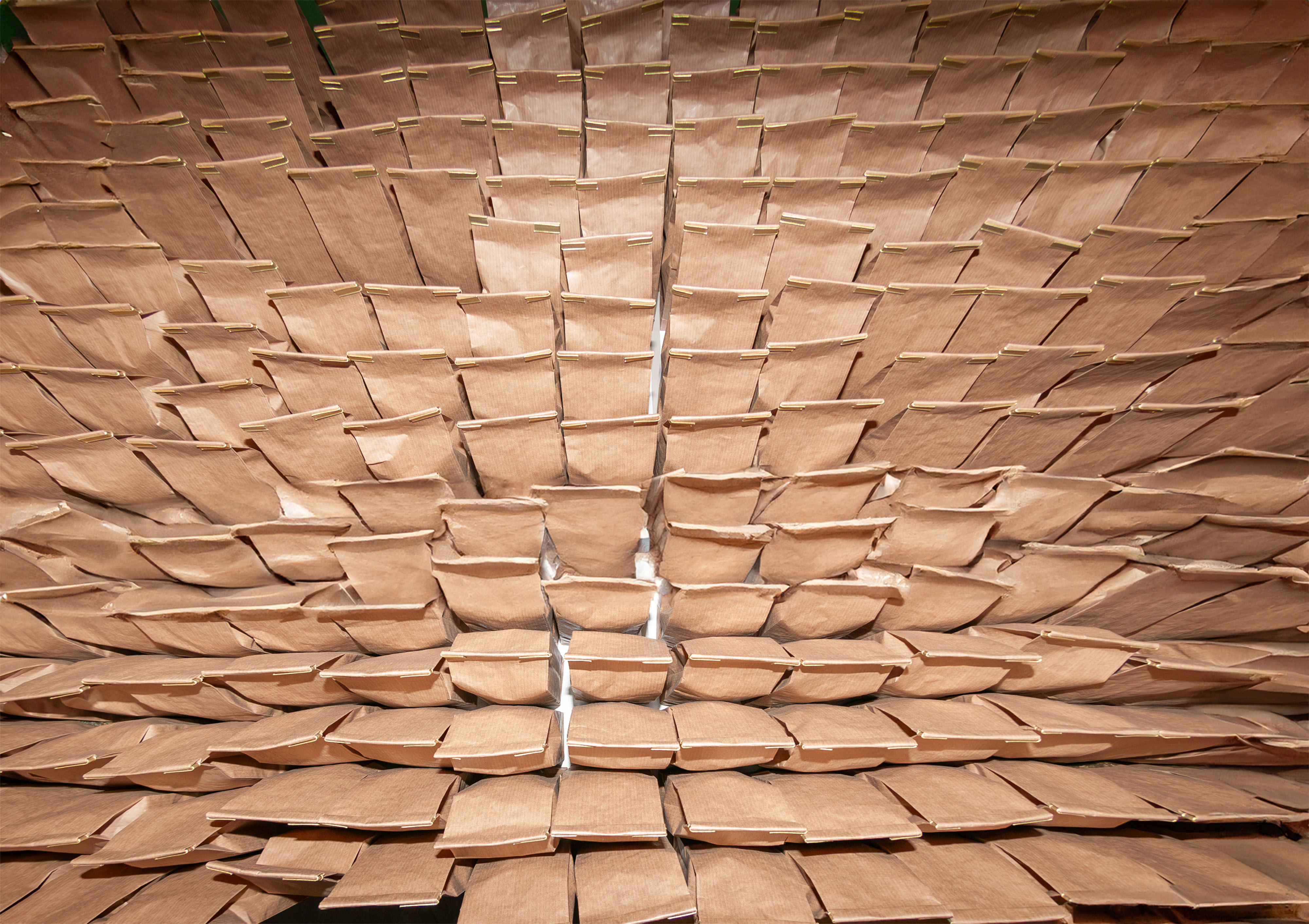 huge number of craft paper bags background seen from the top