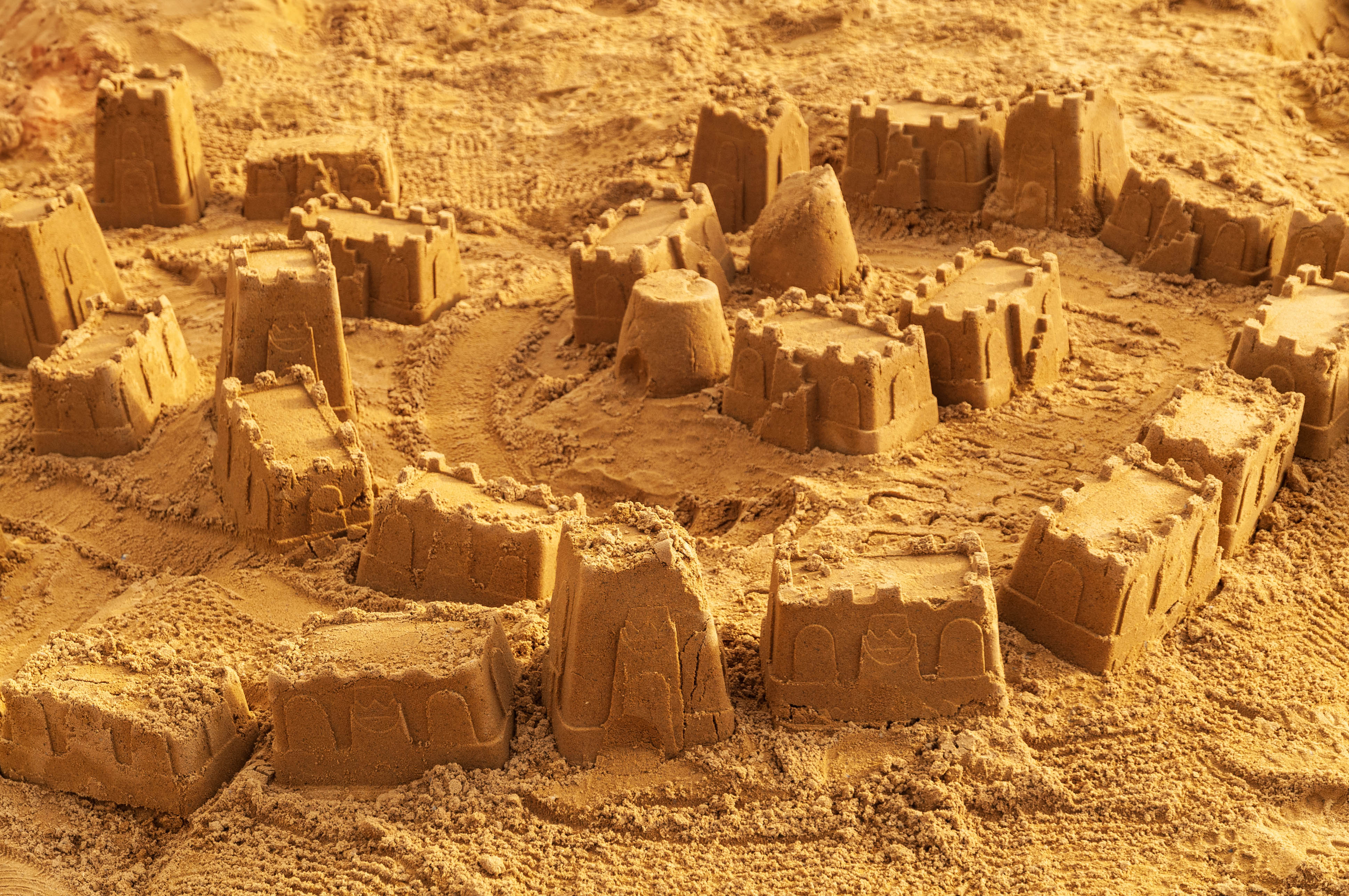 Sandcastles playground castle buckets full frame sand back