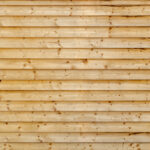 Stacked pine wood planks wall background