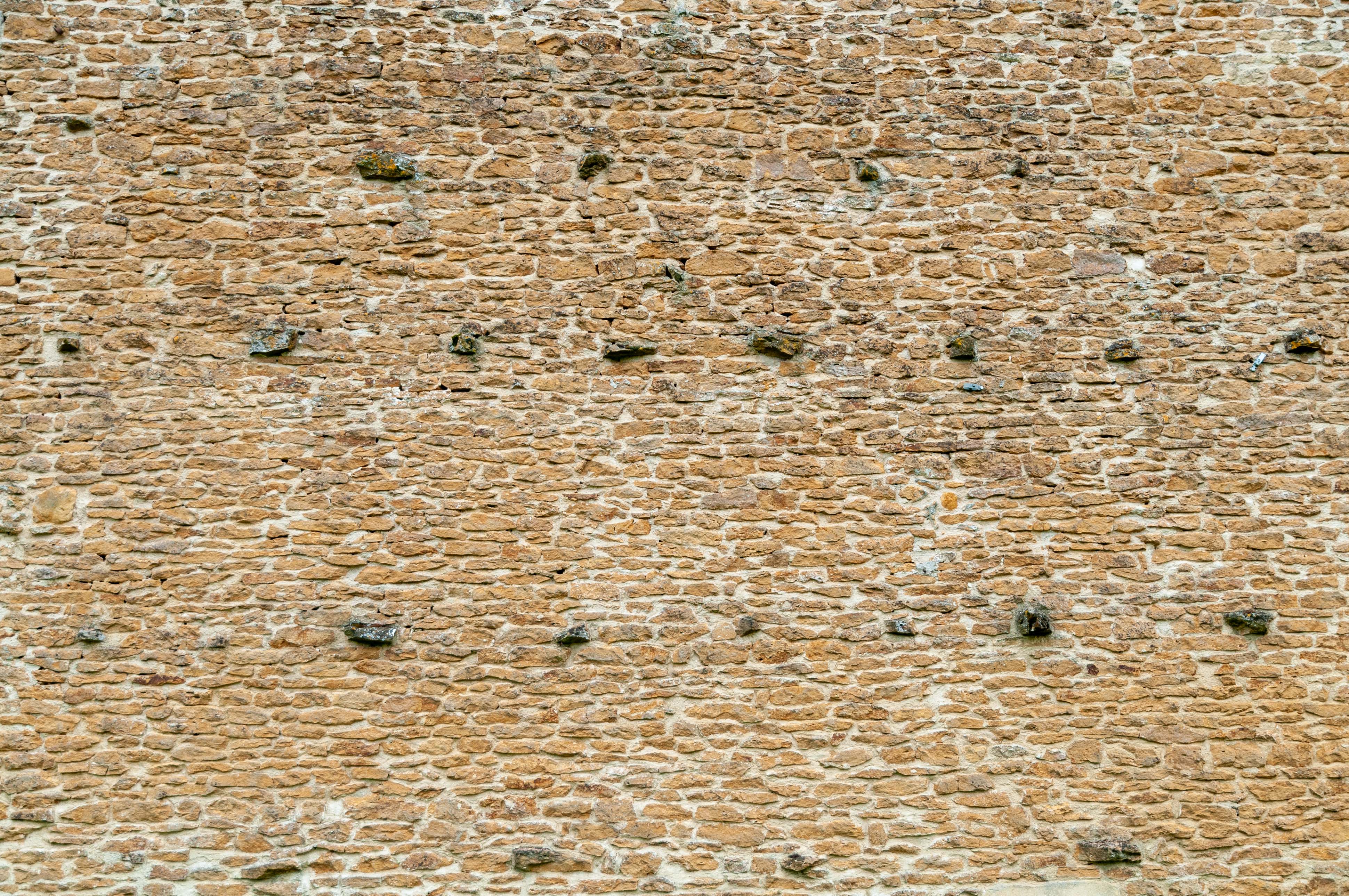 Old Frrench farm bricks wall background