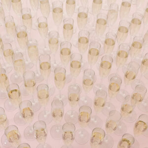 Table filled with lots of champagne glasses