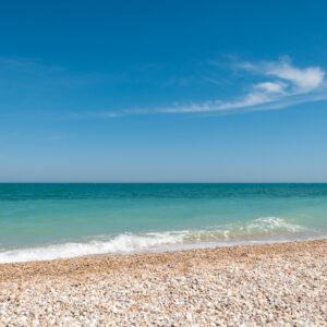 Sky blue bondi beach pebble stones sea holiday background